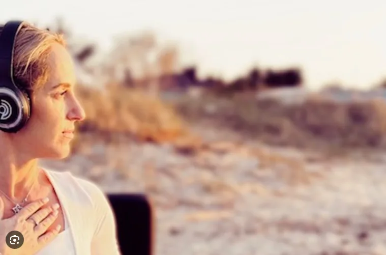Liina Täht wearing 9D Breathwork headphones outdoors